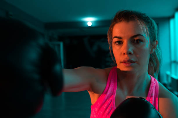 istock Close-up image of female boxer punching. 946987658