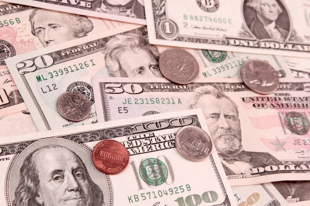 istock American coins and banknotes 946995982