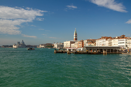 Landing stage in Venice with the Campanile of St Mark`s Basilica in the background, the most popular landmark in the city of Venice