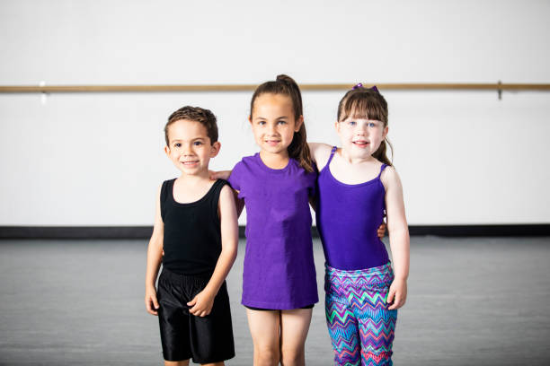 istock Diverse group of children smiling at dance practice 947000544