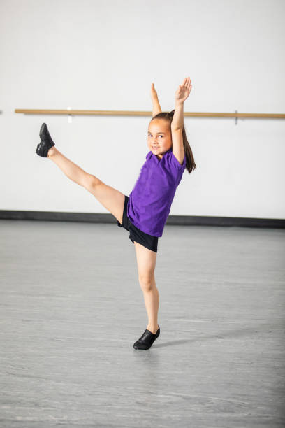 cute little girl practicing at dance studio - jazz dance imagens e fotografias de stock