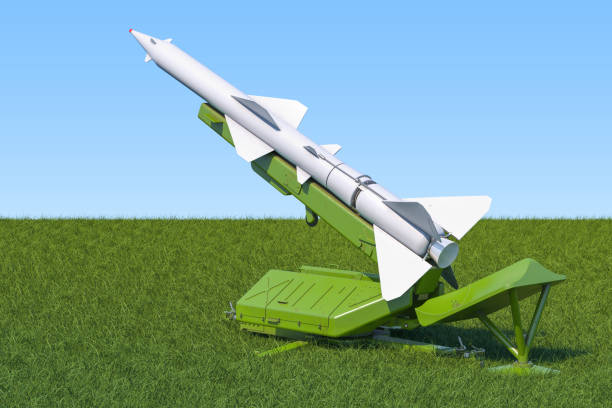 istock Missile defence system on the green grass against blue sky, 3d rendering 947004176