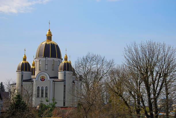 Beautiful cathedral among the trees in the spring. Church in nature. Wind world. Place of power.