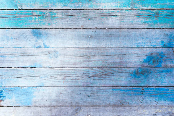 istock Wooden rustic pattern - old boards with remains of blue paint 947014304