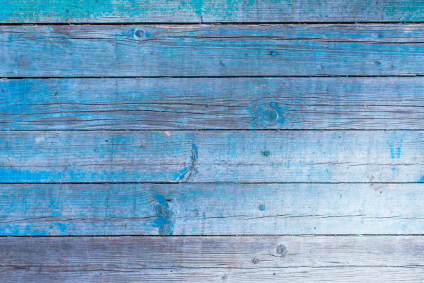 istock Wooden rustic pattern - old boards with remains of blue paint 947014538