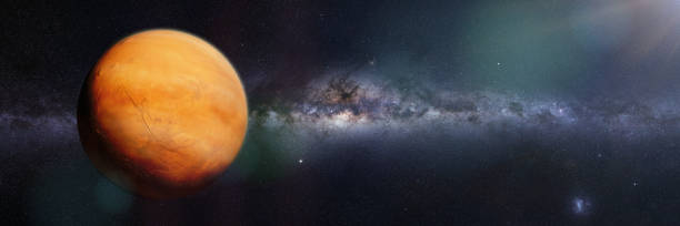 istock planet Mars with sand storm and clouds, lit by the galaxy 947018420