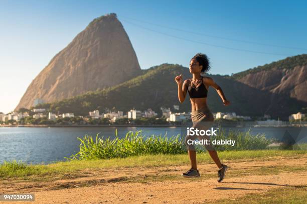 Fitness Woman Running On A Dirt Road Stock Photo - Download Image Now - Running, Exercising, One Woman Only