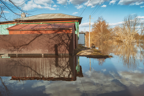 Russia, Balashov April 14, 2018. Sunken underwater fence street houses property. Flooded during the spring flood of the Hoper River suburban . High water in the river stream Cityscape town embankment