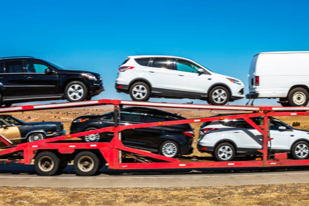 Car carrier trailer - Texas/Oklahoma Gray County, Texas, USA - February 17, 2014: Car carrier trailer on interstate in Texas not far from Oklahoma state. car hauling stock pictures, royalty-free photos & images