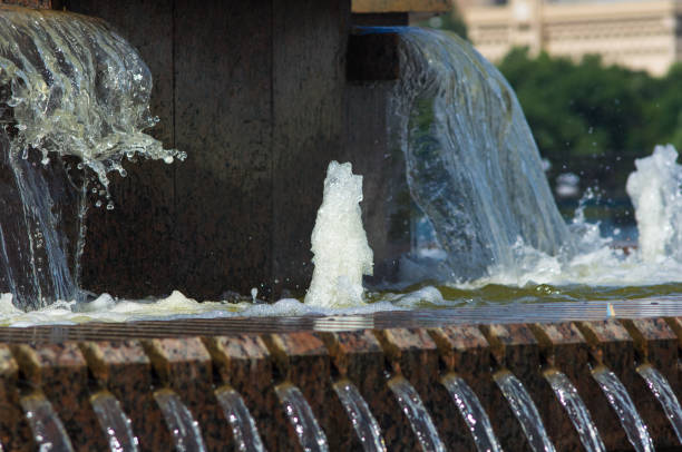 istock Fountain in city park on hot summer day 947033634