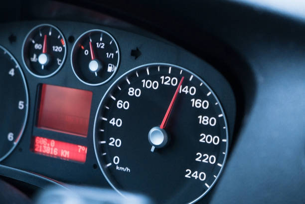 Driving at high speed, speedometer close-up stock photo