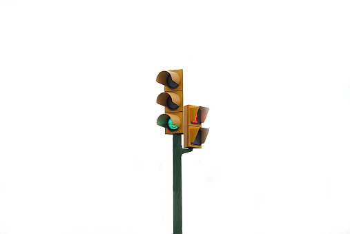 yellow traffic light with green light on