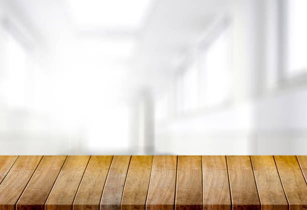 istock Wooden board empty table  window blurred background can be used for display or montage your products and Mock up 947048204