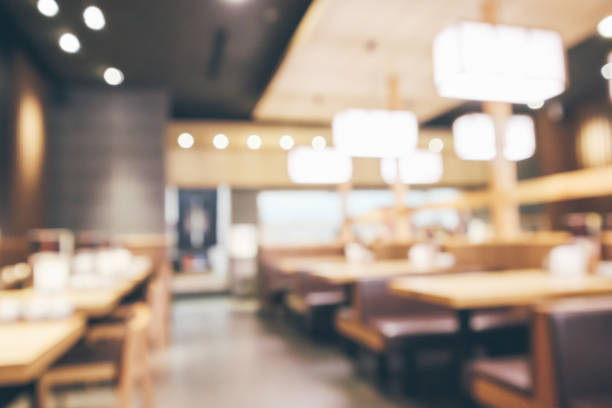 istock abstract blurred cafe restaurant with bokeh lights defocused background 947054872