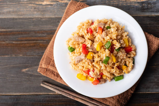 Fried rice with vegetables and pork Fried rice with vegetables and pork, Thai cuisine, top view fried rice stock pictures, royalty-free photos & images