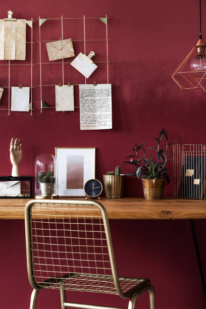 istock Gold chair in red room interior 947055882