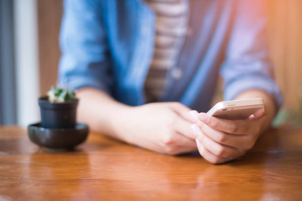 istock Woman holding smartphone 947062004