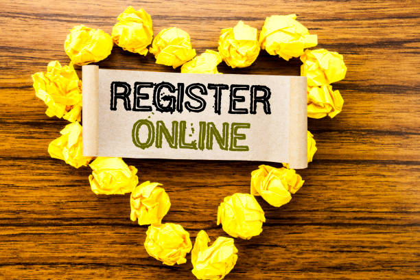 istock Word, writing Register Online. Business concept for Internet Subscribe written on sticky note paper on the dark wooden background. With yellow folded paper heart meaning love or adoration. 947062180