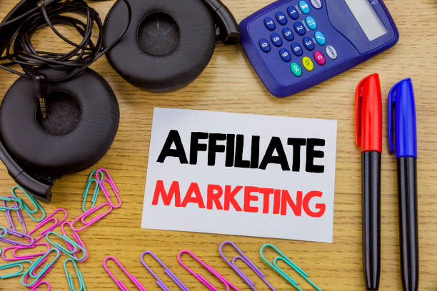 istock Writing text showing Affiliate Marketing. Business concept for Internet Online written on sticky note paper on the wooden background. With calculator and pen marker and headphones 947065962