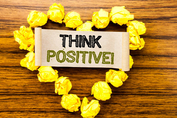 istock Word, writing Think Positive. Business concept for Positivity Attitude written on sticky note paper on the dark wooden background. With yellow folded paper heart meaning love or adoration. 947068796