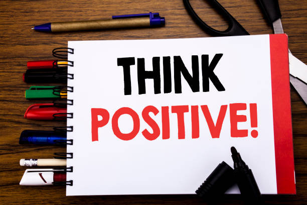 istock Handwritten text showing Think Positive. Business concept for Positivity Attitude Written on notebook, wooden background with office equipment like pens scissors colourful marker 947068988