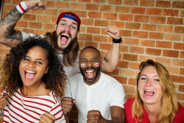 istock Friends cheering world cup with painted flag 947069510