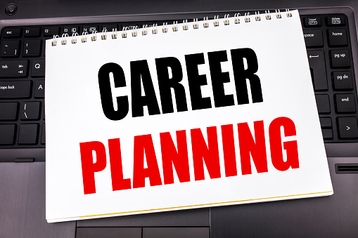 Handwritten text showing Career Planning. Business concept writing for Job Goal Success written on notepad note paper the black keyboard background.