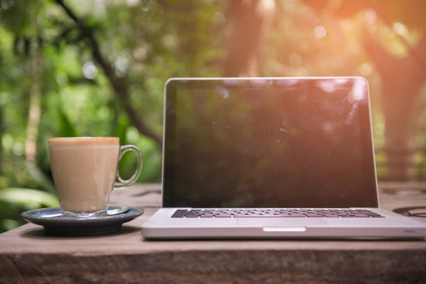 istock Coffee cup and laptop for business, Selective focus on coffee. 947074606