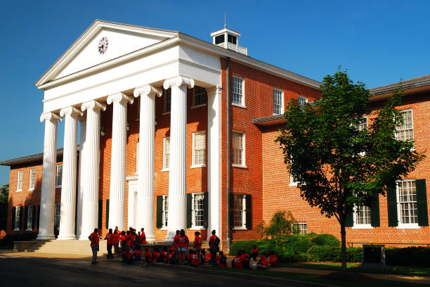 The University of Mississippi's Lyceum Building Oxford, MS, USA July 21, 2010 A group of prospective students tour the University of Mississippi's campus in Oxford, taking a break near the Lyceum Building, one of the oldest on the school's campus oxford mississippi photos stock pictures, royalty-free photos & images