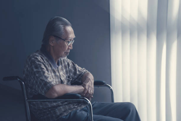 istock Lonesome senior man sitting on wheelchair 947077826