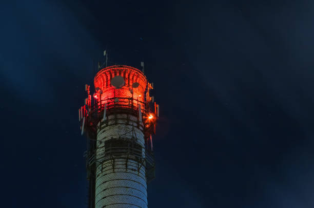 istock Illuminated Brick Tower Of Thermal Station At Night 947078128