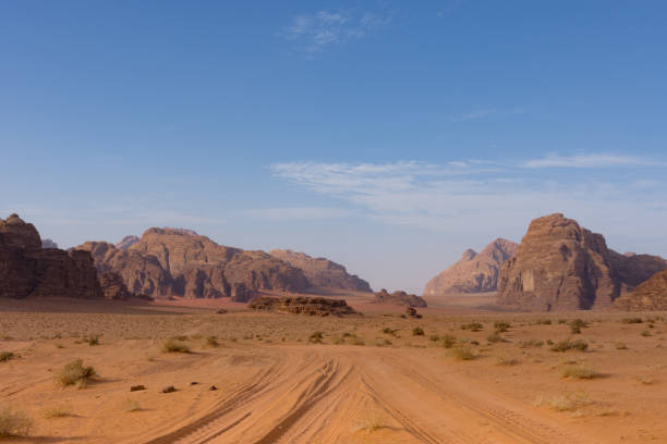 istock Tracks Through the Orange Sand of Wadi Rum 947092308