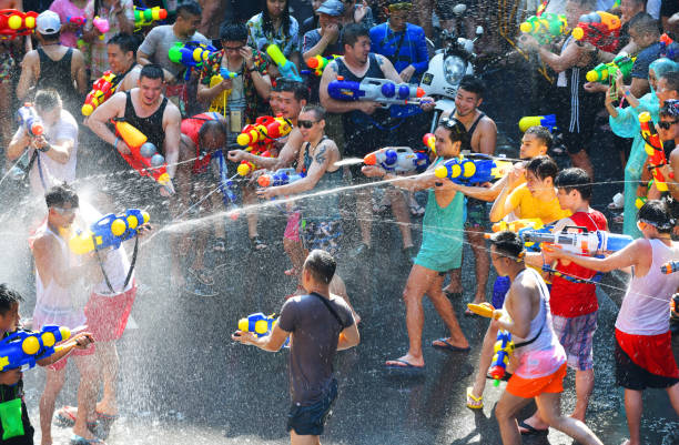 Songkran festival in Bangkok ,Thailand People happy and funny playing water in Songkran festival at Silom Road in Bangkok. khao san road stock pictures, royalty-free photos & images