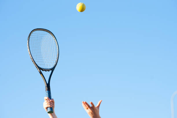 istock Tennis racket in hand and ball 947095922