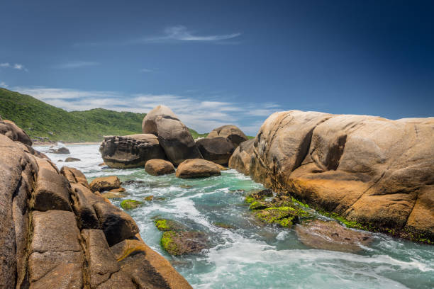 istock rocks in the sea 947099262