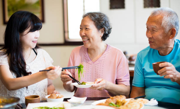 istock daughter and senior parent enjoy dinner in restaurant 947111984
