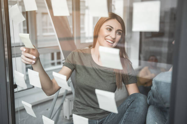 istock Satisfied girl making notes for staff 947116508