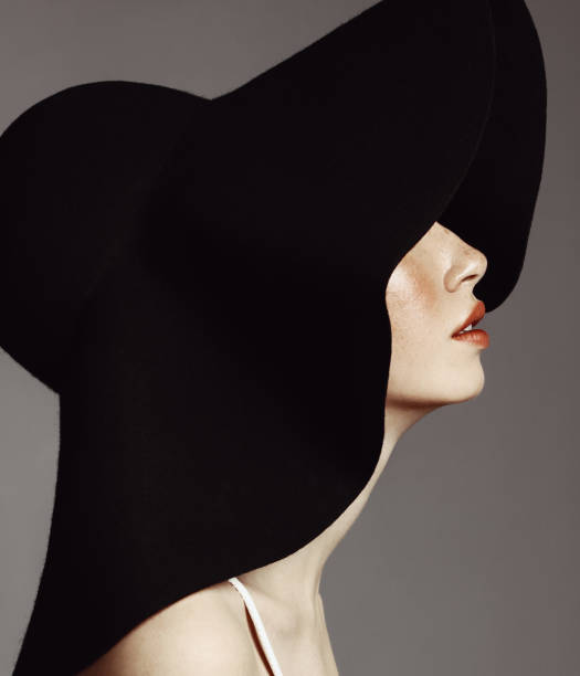 istock Beautiful elegant woman with hat 947118972