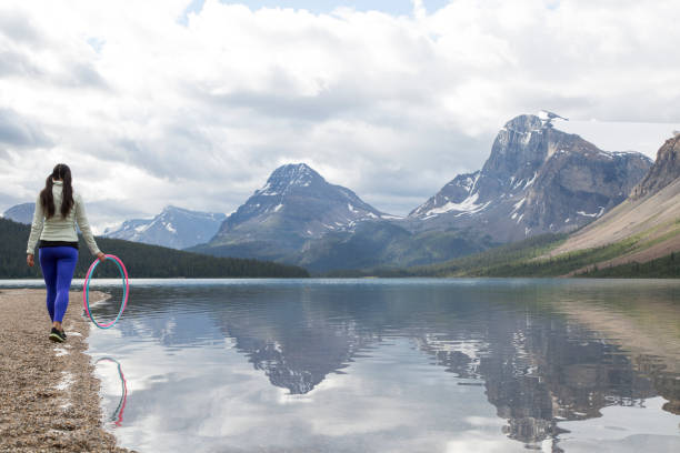 Majestic mountain backdrop reflecting in serene, tranquil lake waters.