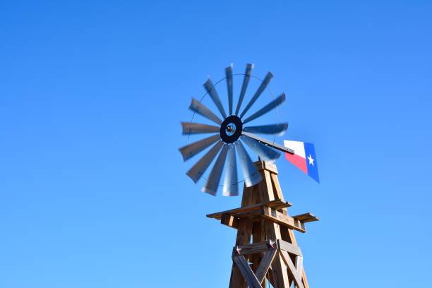 istock Windmill on an agricultural farm 947120520