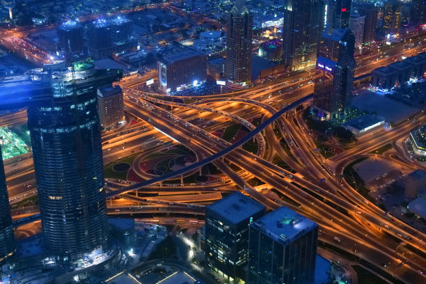 istock Dubai road junction view from above at night, UAE 947120732