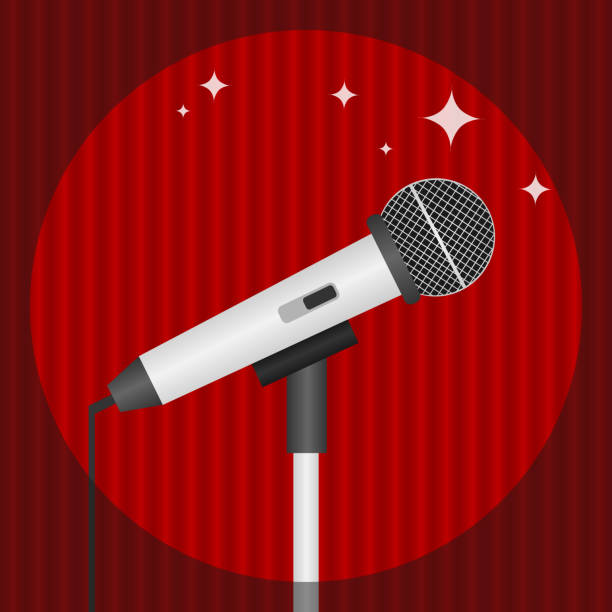 istock A microphone on a background of red curtains, lit by a realistic microphone. 947124558