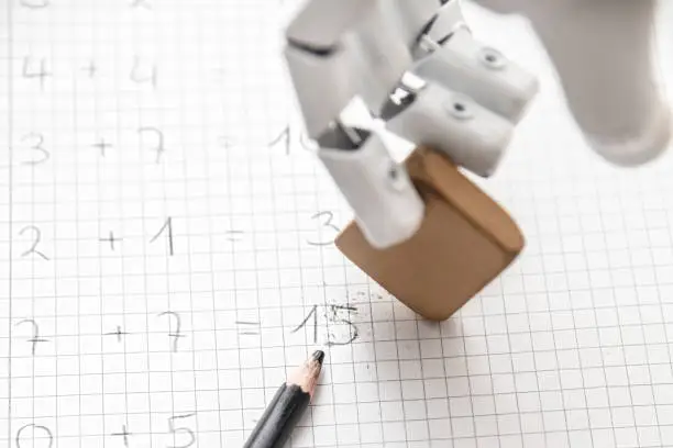 the cyborg hand of an autonomous roboter is using a rubber to solve a arithmetic