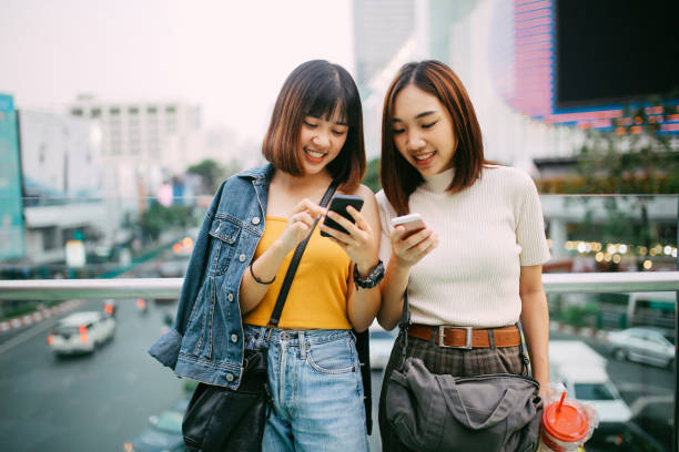 istock Young Asian in Bangkok, chatting over social media 947136848