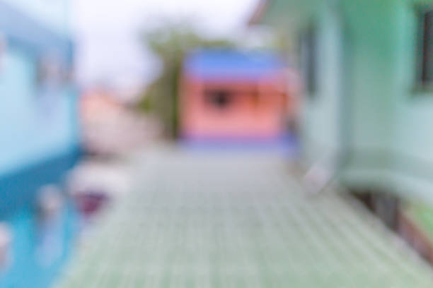 istock Blurred view of homes and roof seen from second floor window 947137380