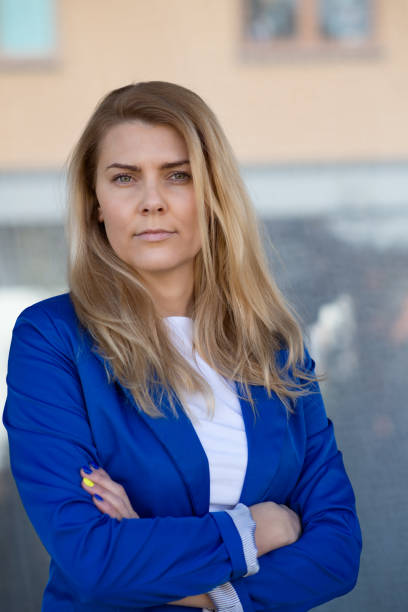 istock Young elegant business woman in blue jacket. 947140510