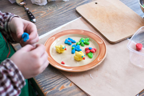 istock culinary class for children and parents - cooking Easter cake, on the table lie the ingredients and tools for work, the cooking process 947144052