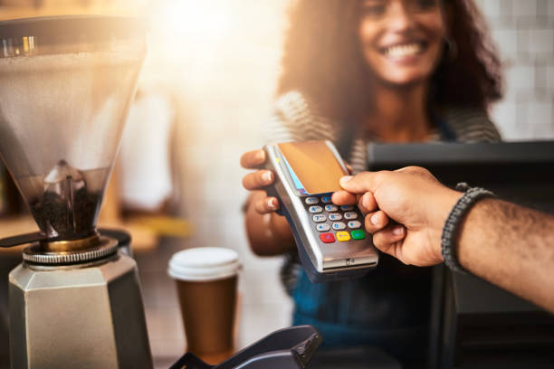 the smart, effortless and easy way to pay - coffee serving cafeteria worker checkout counter imagens e fotografias de stock