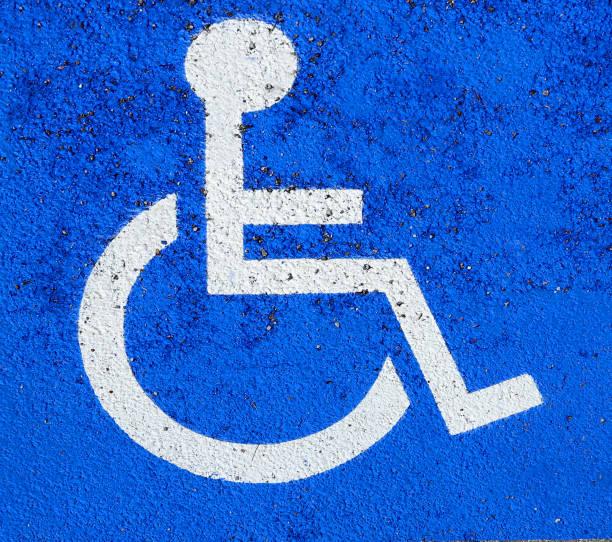 istock parking car with wheelchair symbol 947144724