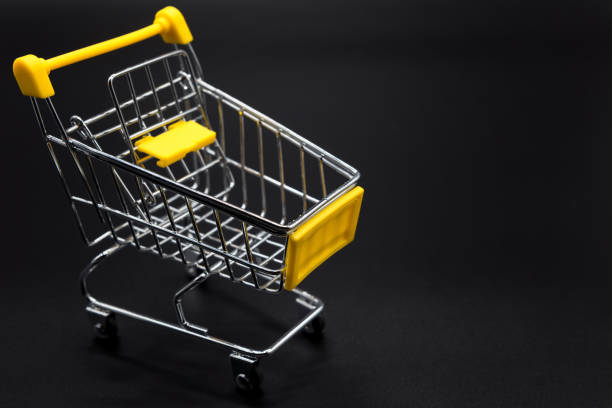 istock Yellow mini cart or trolley on black 947147872